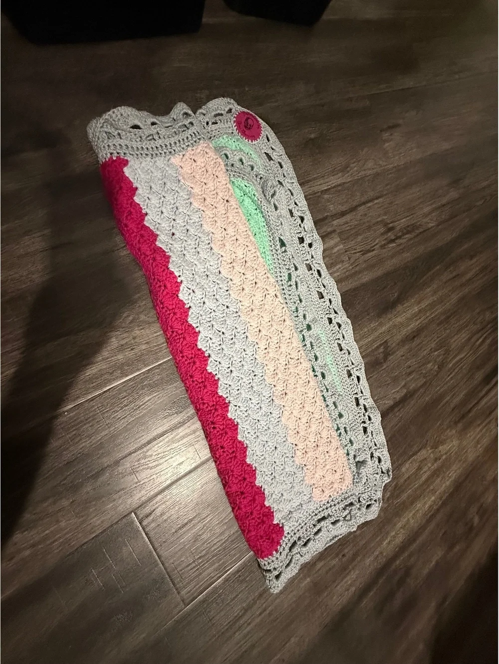 Handmade baby blanket signed by crafter with logo